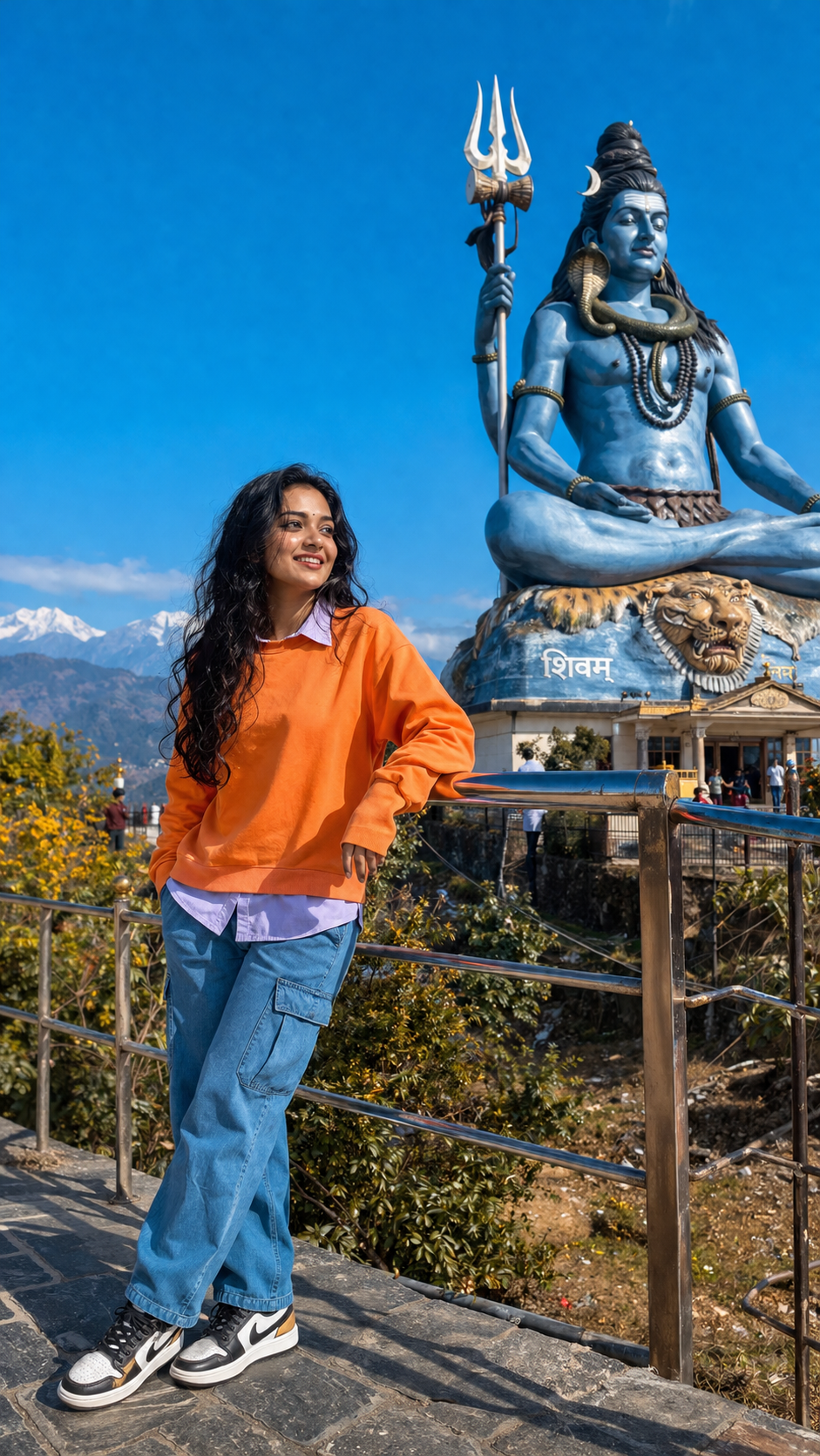 Temple visit with Shiva statue backdrop