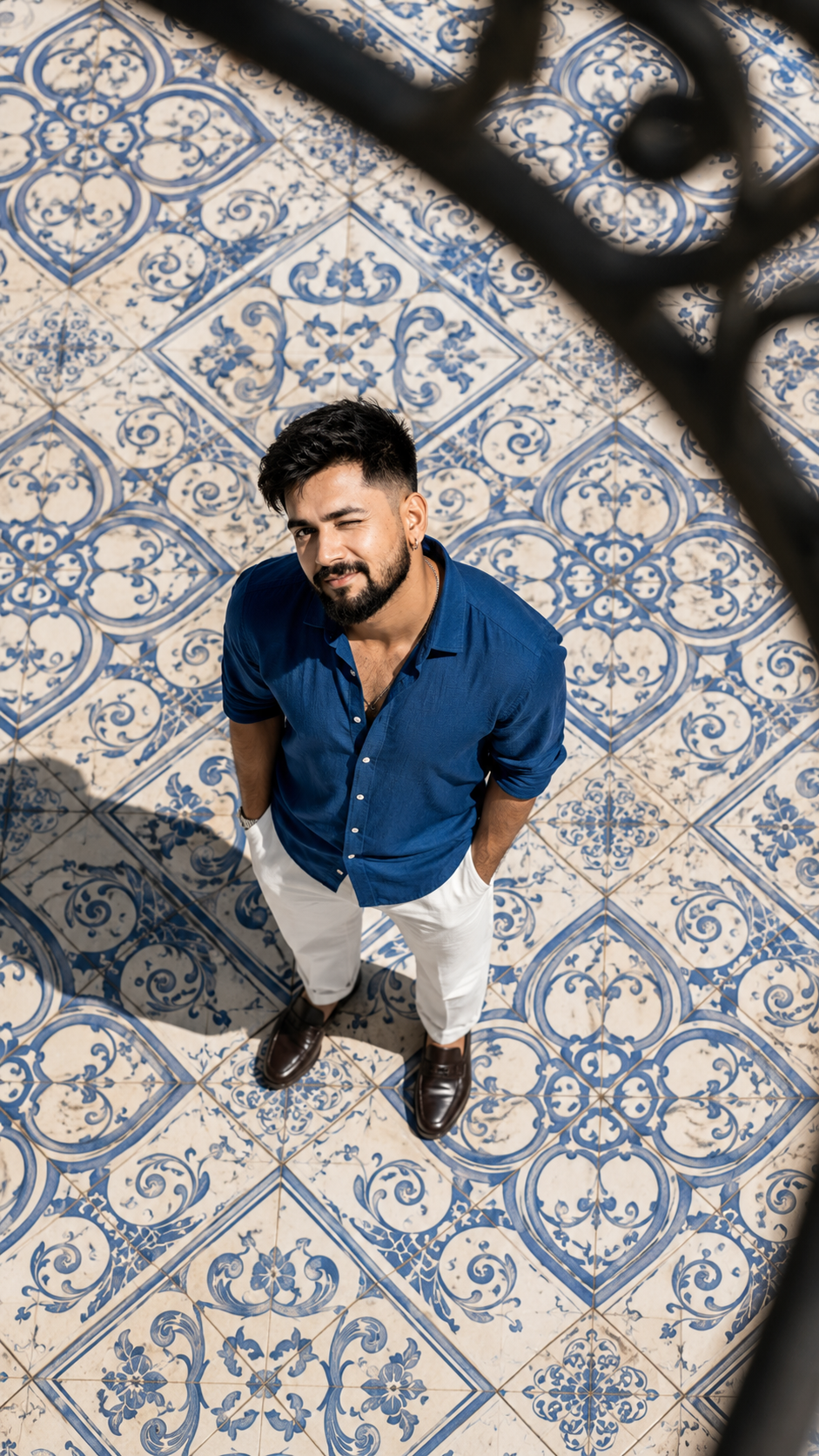 Winking Man on a Blue Tile Mosaic